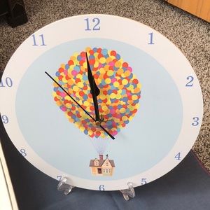 “Up” collectible clock w/plastic stand for display/also wall mountable. New.